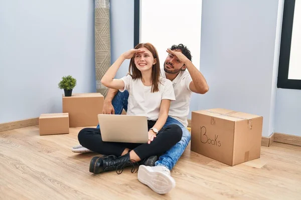 Young Couple Using Laptop New Home Very Happy Smiling Looking — Stockfoto