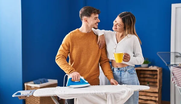 Young Man Woman Couple Ironing Clothes Drinking Coffee Laundry Room — ストック写真