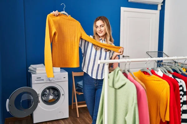 Young Blonde Woman Smiling Confident Holding Clothes Rack Laundry Room — Stockfoto