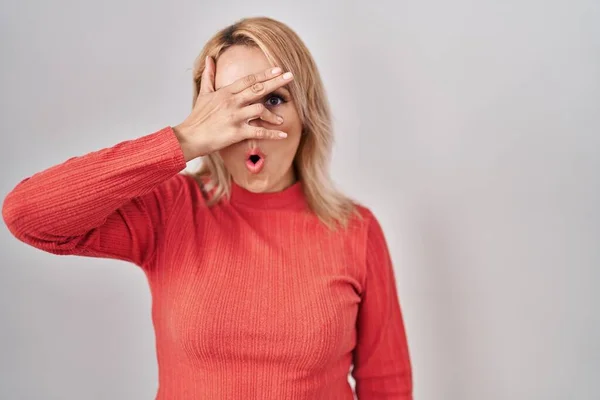 Blonde Woman Standing Isolated Background Peeking Shock Covering Face Eyes — Fotografia de Stock