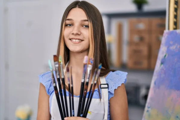 Adorable Girl Smiling Confident Holding Paintbrushes Art Studio — Zdjęcie stockowe