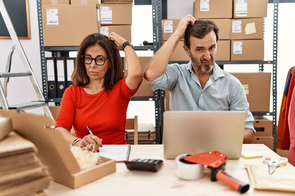 Middle Age Couple Working Small Business Ecommerce Confuse Wondering Question — Stockfoto