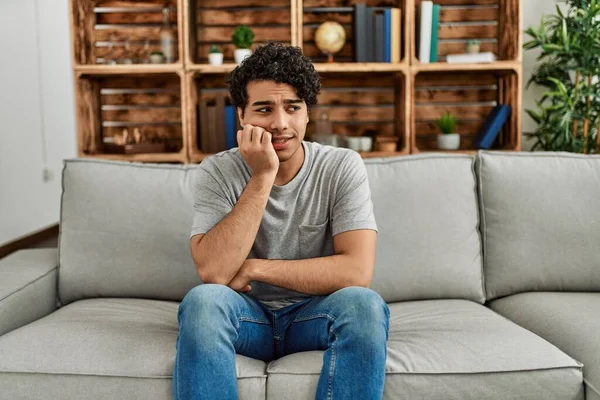 Young Hispanic Man Wearing Casual Clothes Sitting Sofa Home Looking — Stock Photo, Image