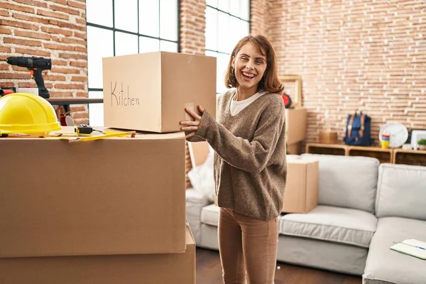 Young Caucasian Woman Smiling Confident Holding Kitchen Package New Home — Stockfoto