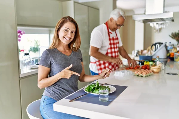 Middle Age Hispanic Couple Eating Healthy Salad Home Smiling Happy — 图库照片