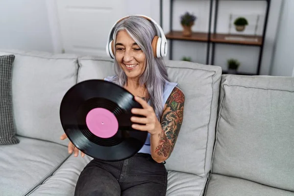 Middle Age Grey Haired Woman Listening Music Holding Vinyl Disc — 图库照片