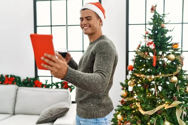 Young Hispanic Man Make Selfie Touchpad Drinking Wine Standing Christmas — 스톡 사진