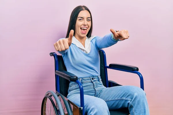 Beautiful Woman Blue Eyes Sitting Wheelchair Approving Doing Positive Gesture — стоковое фото