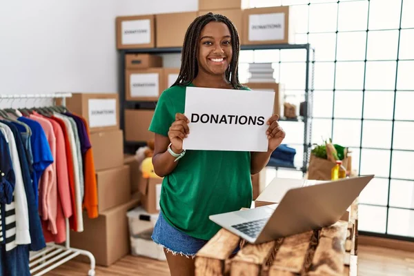 Young African American Woman Wearing Volunteer Uniform Holding Donations Banner — Stock Photo, Image
