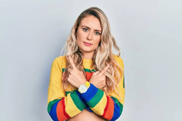 Beautiful Young Blonde Woman Wearing Colored Sweater Pointing Both Sides — Fotografia de Stock