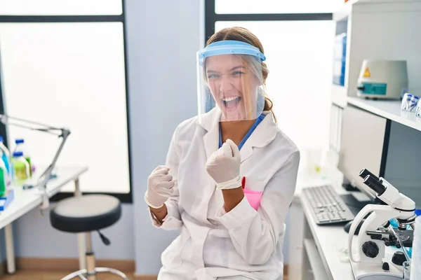 Young Blonde Woman Working Scientist Laboratory Wearing Face Mask Celebrating — Φωτογραφία Αρχείου