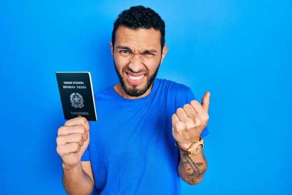 Hispanic Man Beard Holding Italy Passport Angry Mad Raising Fist — Stock Fotó