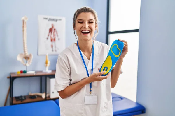 Young Woman Holding Shoe Insole Physiotherapy Clinic Smiling Laughing Hard —  Fotos de Stock