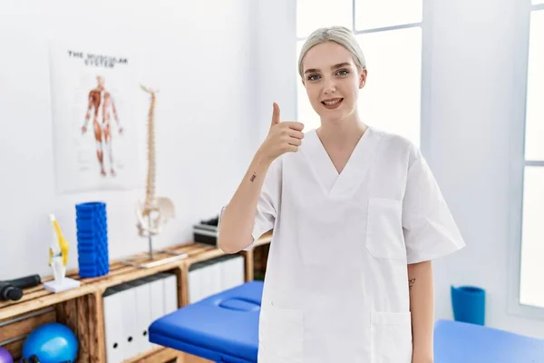 Young Caucasian Woman Working Pain Recovery Clinic Doing Happy Thumbs — Fotografia de Stock
