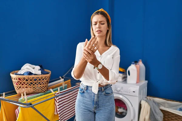 Young Blonde Woman Laundry Room Suffering Pain Hands Fingers Arthritis — Stockfoto