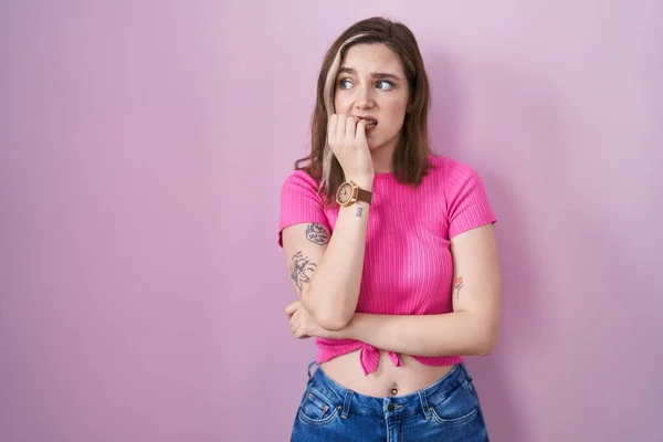 Blonde Caucasian Woman Standing Pink Background Looking Stressed Nervous Hands — стоковое фото