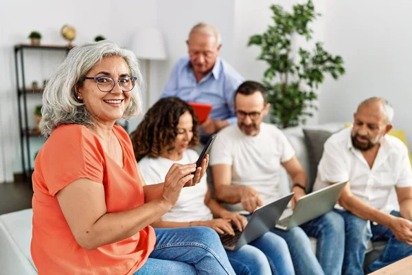 Group Middle Age Friends Using Laptop Smartphone Sitting Sofa Home — Stock Photo, Image