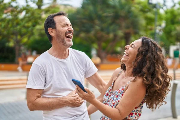 Man Woman Couple Smiling Confident Using Smartphone Park — стоковое фото
