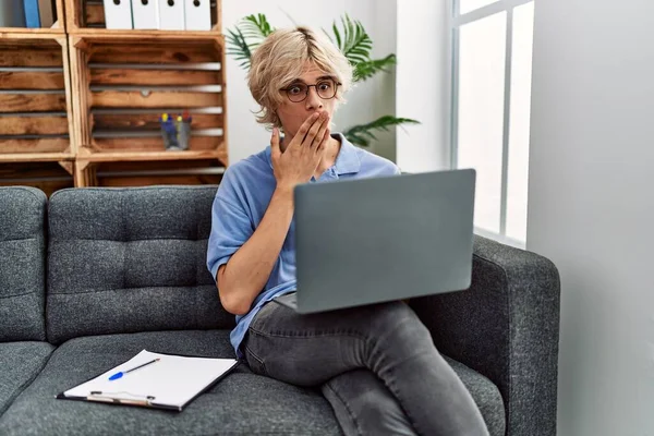 Young Man Working Using Computer Laptop Sitting Sofa Covering Mouth — 스톡 사진