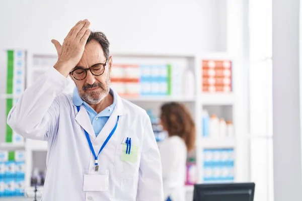 Middle Age Hispanic Man Working Pharmacy Drugstore Surprised Hand Head — Foto de Stock
