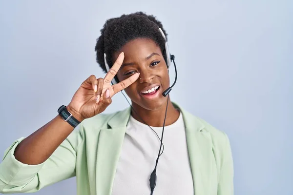 African American Woman Wearing Call Center Agent Headset Doing Peace — Stockfoto