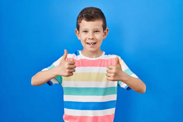 Young Caucasian Kid Standing Blue Background Success Sign Doing Positive — Stock Photo, Image