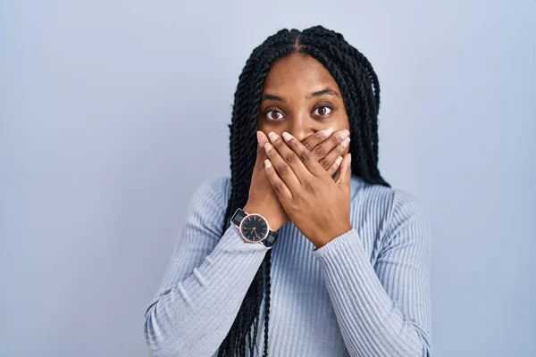 African American Woman Standing Blue Background Shocked Covering Mouth Hands — Fotografia de Stock