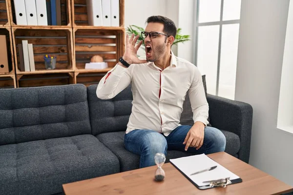 Young Hispanic Man Beard Working Consultation Office Shouting Screaming Loud — kuvapankkivalokuva