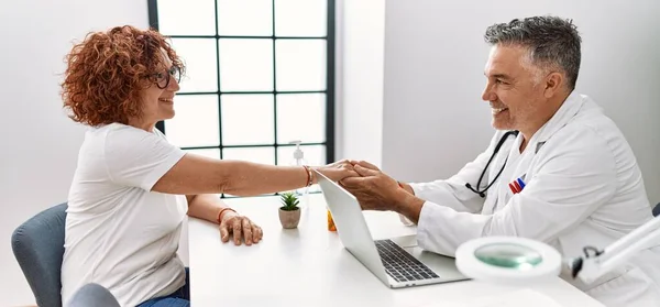 Middle Age Man Woman Wearing Doctor Uniform Having Medical Consultation — Stock Photo, Image
