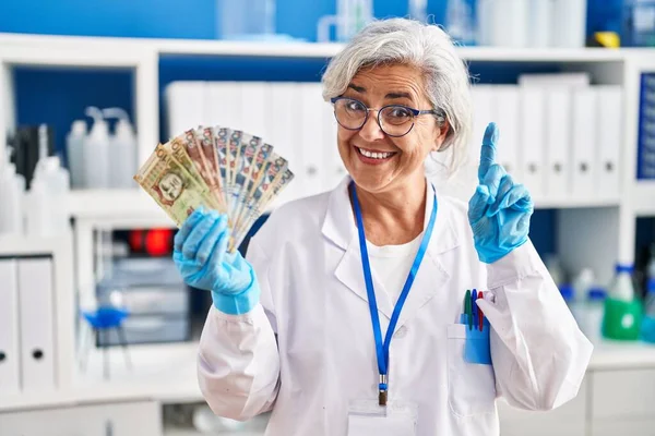 Middle Age Woman Grey Hair Working Scientist Laboratory Holding Polish — Stock Photo, Image