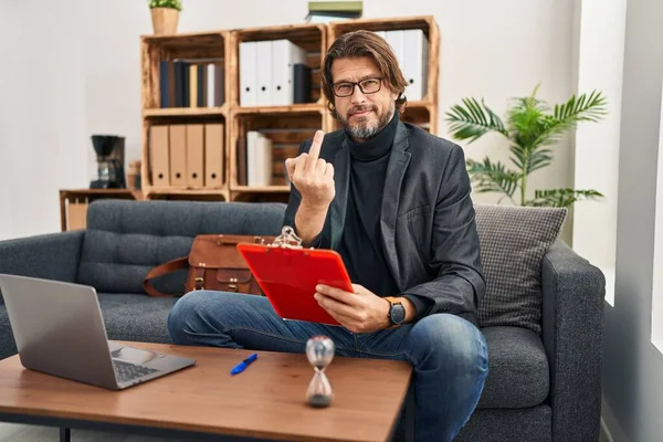 Handsome Middle Age Man Working Consultation Office Showing Middle Finger — Stock fotografie