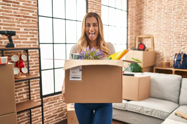 Young Blonde Woman Moving New Home Holding Cardboard Box Sticking — Stock Photo, Image