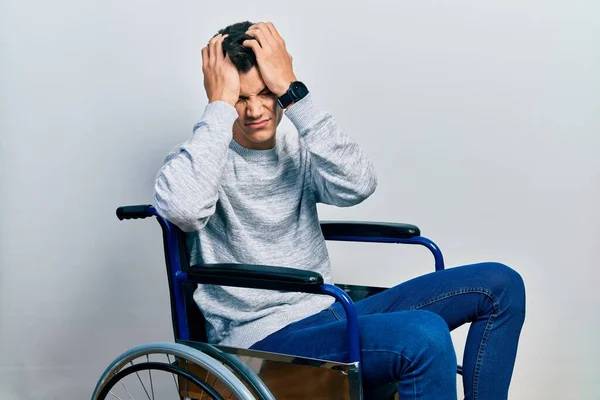 Young Hispanic Man Sitting Wheelchair Suffering Headache Desperate Stressed Because — Foto Stock