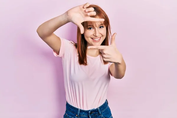 Redhead Young Woman Wearing Casual Pink Shirt Smiling Making Frame — Stock Photo, Image