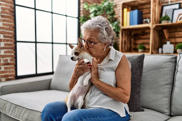 Senior Grey Haired Woman Kissing Hugging Chiuahua Sitting Sofa Home — Photo