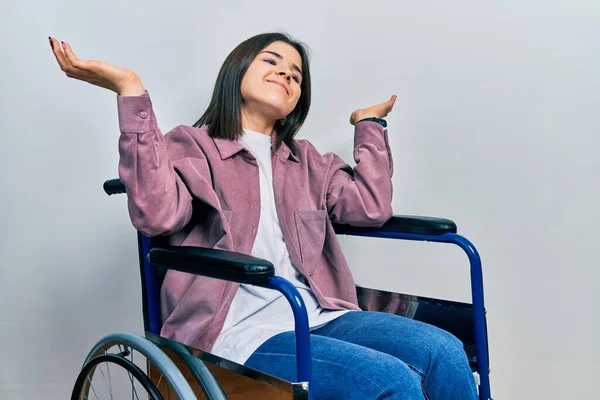 Young Brunette Woman Sitting Wheelchair Clueless Confused Expression Arms Hands — Foto de Stock