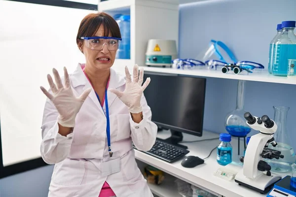 Young Brunette Woman Working Scientist Laboratory Afraid Terrified Fear Expression — Stock Photo, Image