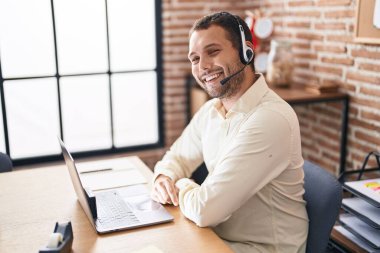 Young man call center agent having video call at office