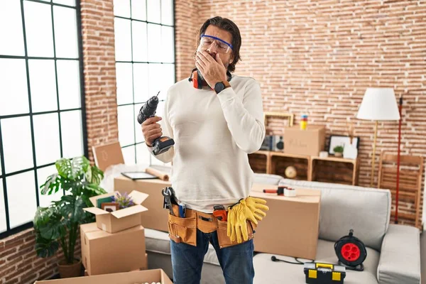 Handsome Middle Age Man Holding Screwdriver New Home Bored Yawning — Fotografia de Stock