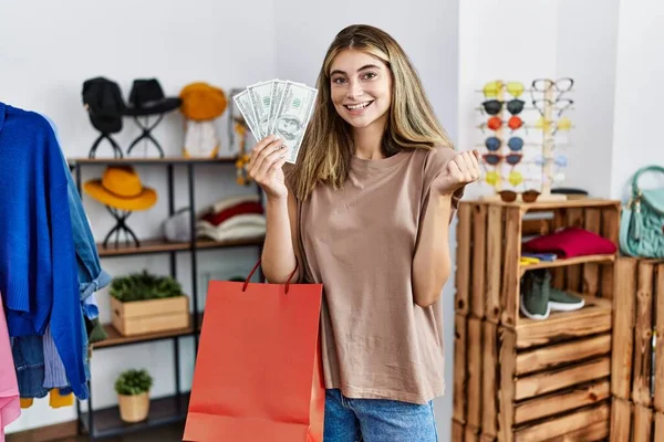 Young Blonde Woman Holding Shopping Bags Dollar Clothing Shop Screaming — Stock Photo, Image