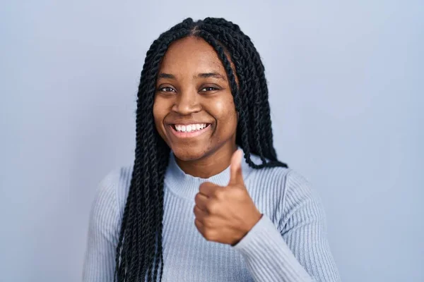 African American Woman Standing Blue Background Doing Happy Thumbs Gesture — стоковое фото