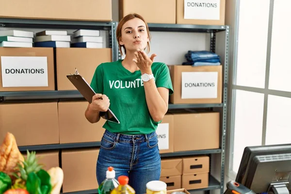 Young Brunette Woman Wearing Volunteer Shirt Donations Stand Looking Camera — Stok fotoğraf
