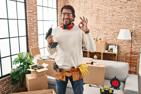 Handsome Middle Age Man Holding Screwdriver New Home Smiling Positive — Stockfoto