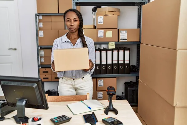 African Woman Working Small Business Ecommerce Holding Box Skeptic Nervous — Stock Photo, Image