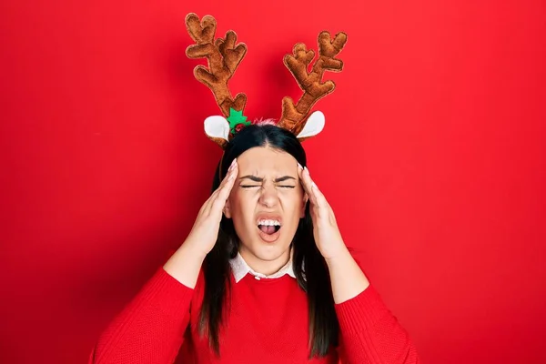 Young Hispanic Woman Wearing Cute Christmas Reindeer Horns Suffering Headache — Photo