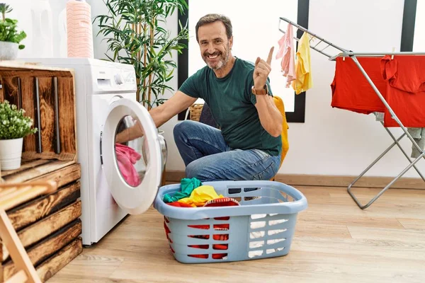 Middle Age Man Beard Putting Laundry Washing Machine Smiling Happy — стоковое фото