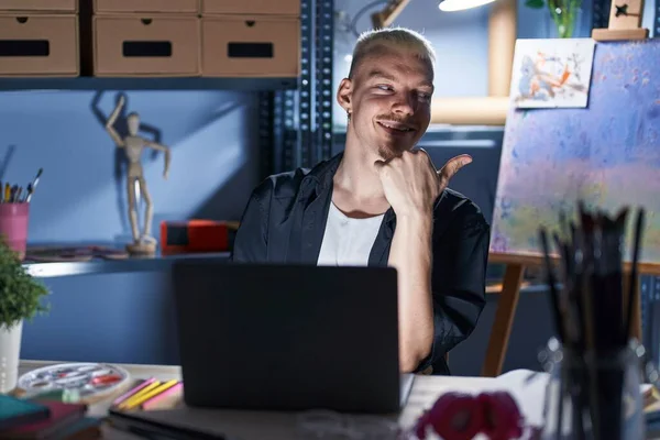 Young Caucasian Man Using Laptop Night Art Studio Smiling Happy — Stock Photo, Image