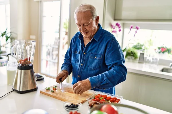 Senior Man Smiling Confident Cutting Datil Kitchen —  Fotos de Stock