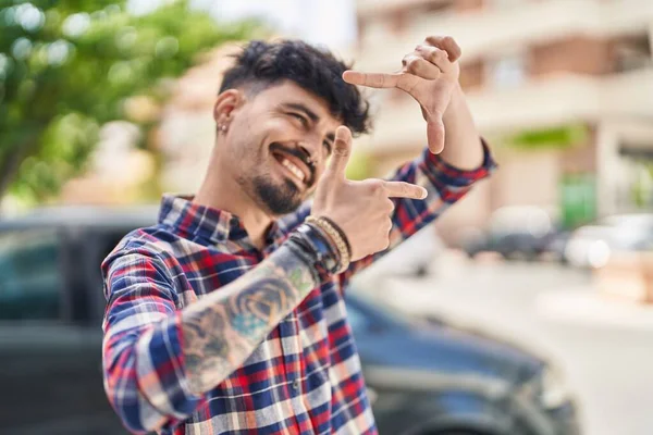 Young Hispanic Man Smiling Confident Doing Photo Gesture Hands Street —  Fotos de Stock