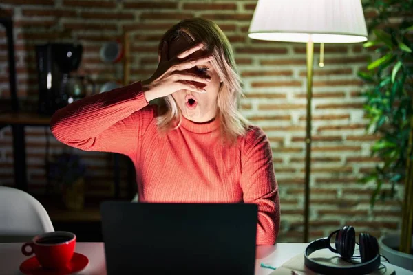 Blonde Woman Using Laptop Night Home Peeking Shock Covering Face — Stock Photo, Image